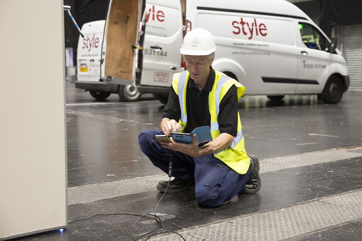 Movable wall being serviced